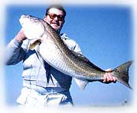 Captain Kelley Wiggins with redfish