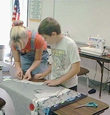 4-H - Boys & girls learning to sew.