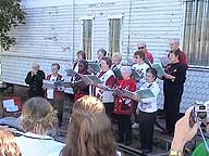 Choir sings period songs.