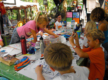 Kids working on the art table Kids working on the art table