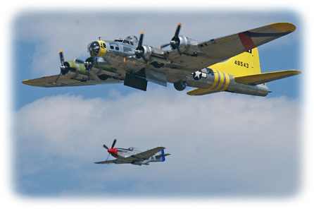 B-17 being escorted by a P-51 on a bombing mission.