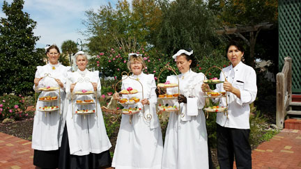 Docents serving tea at Women's History Month