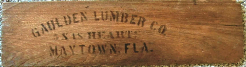 Bundle board under old roofing shingles.