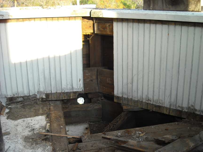 Downstairs porch before restoration. Downstairs porch before restoration.