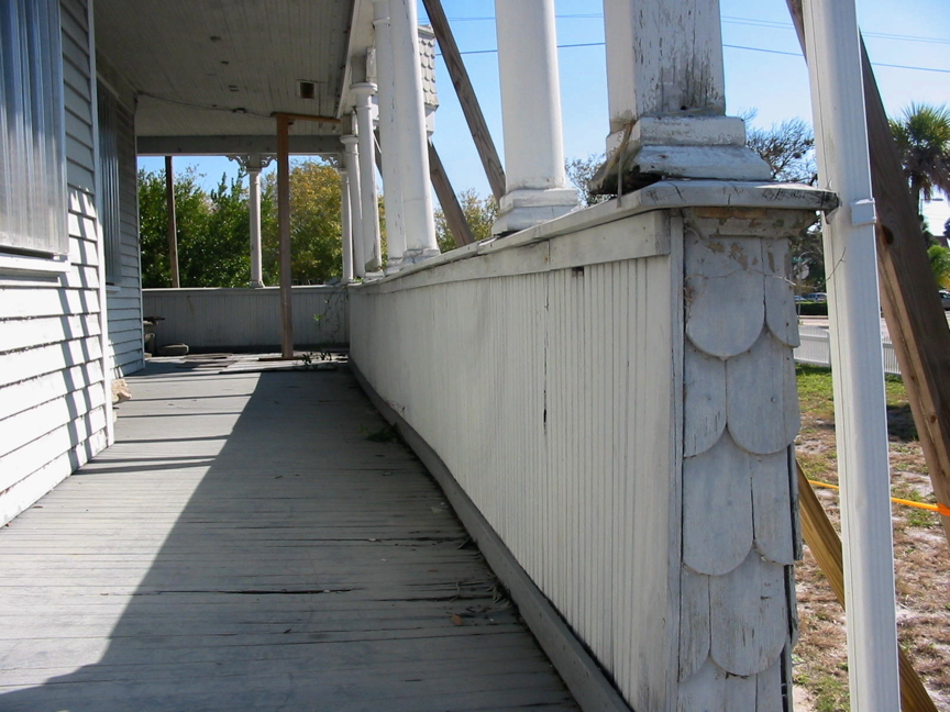 Downstairs side porch before restoration. Downstairs side porch before restoration.