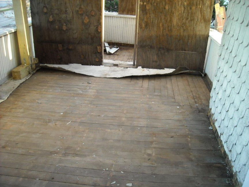 Wood subflooring under metal tiled floor on upstairs porch. Wood subflooring under metal tiled floor on upstairs porch.