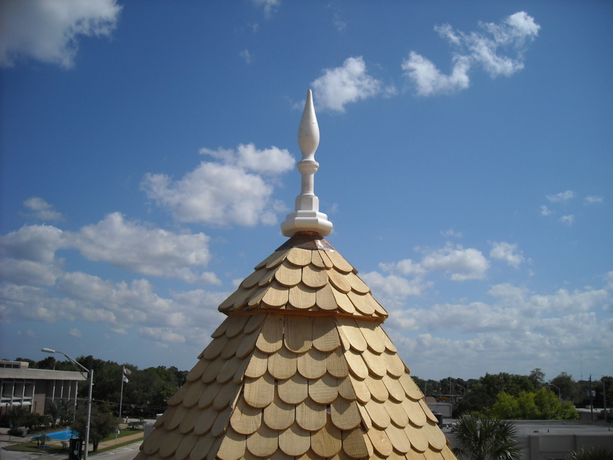 Turret with new shingles and finial installed. Turret with new shingles and finial installed.