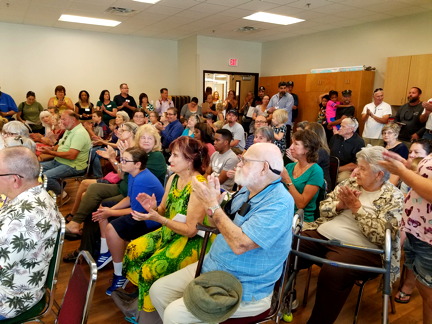 Happy citizens at the Grand Opening meeting.